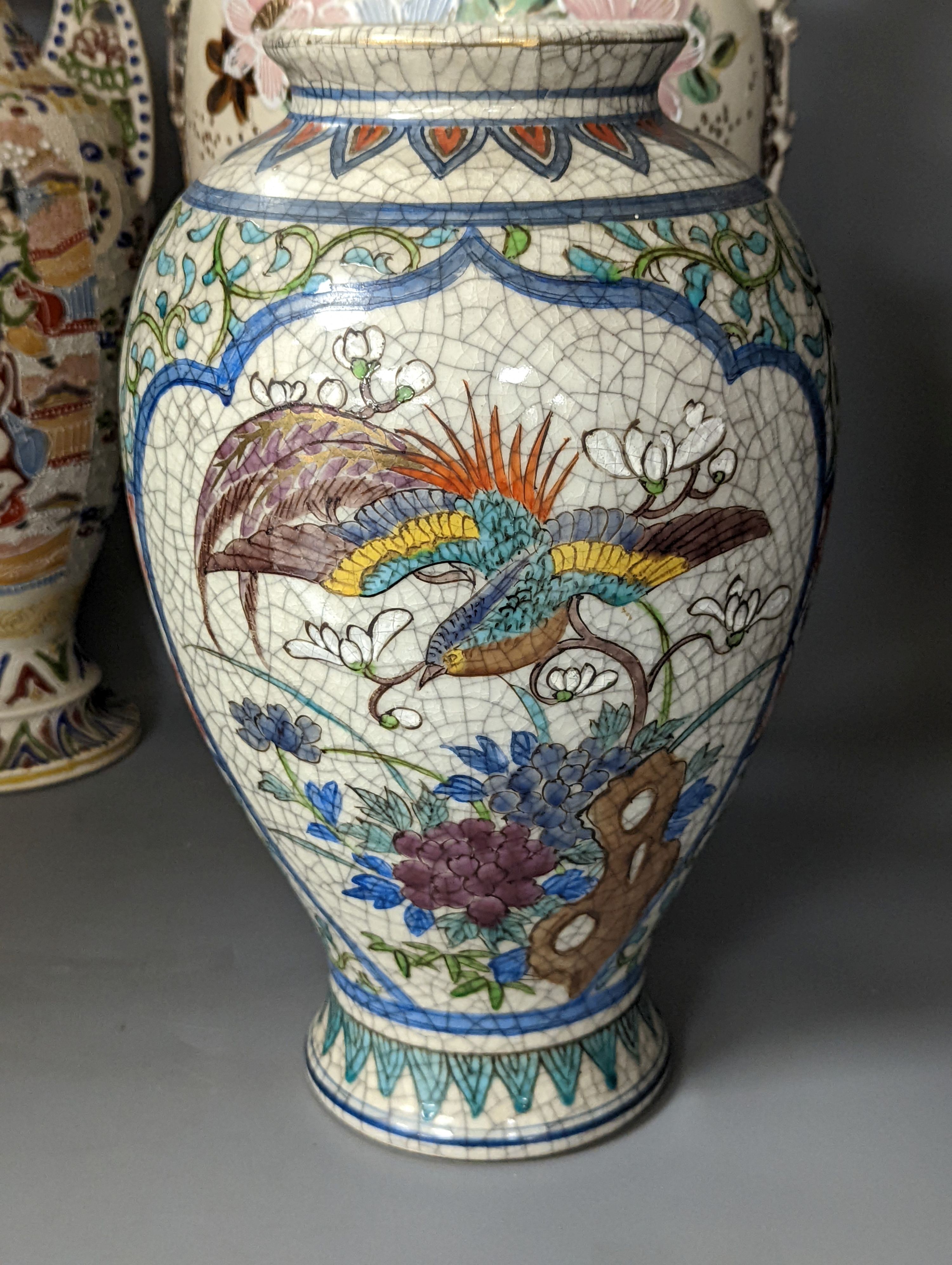 A pair of Japanese crackle ware vases, a lidded vase and 2 others, tallest 60 cms high.